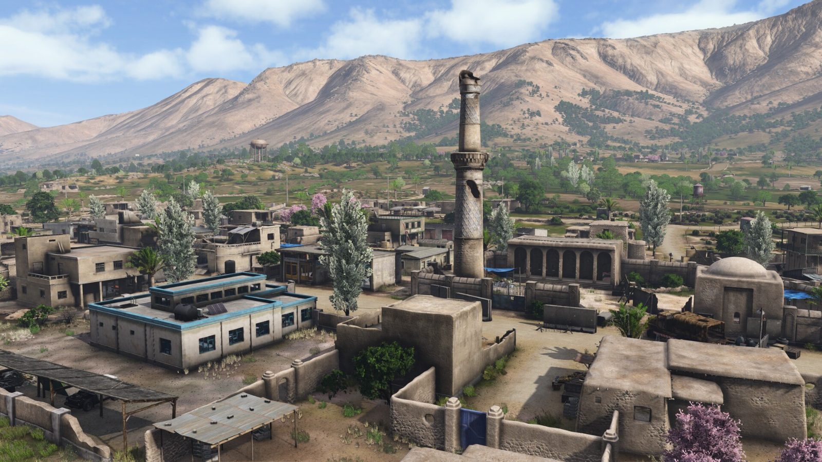 The rooftops of a Nasdara town under the ridgeline.