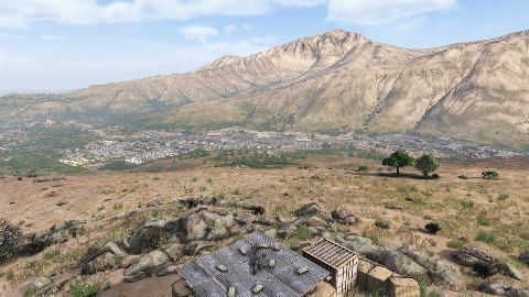 The Nasdara valley from a ridge, mountains behind.