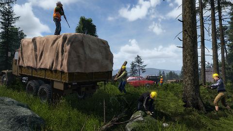 An M3S truck loaded with a tent moves through the forest.
