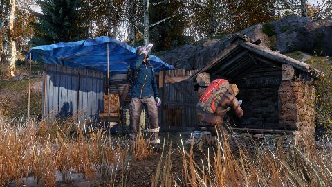 A survivor caught in the open outside a hunting cabin.